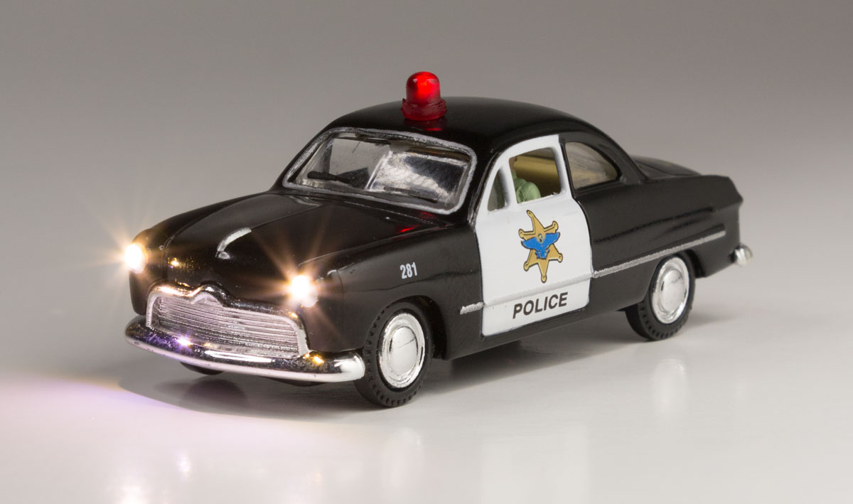 Police Car - HO Scale - Protecting the town and looking for hooligans, this Police Car isn't afraid to flag down those rambunctious law breakers