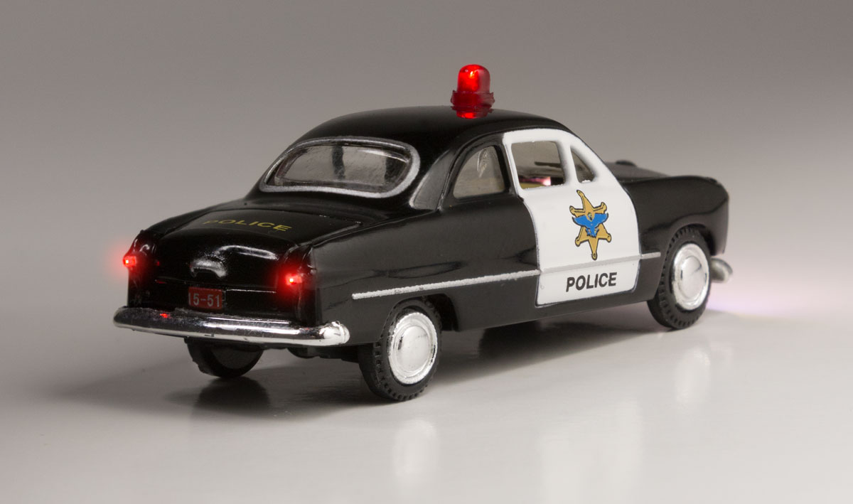Police Car - HO Scale - Protecting the town and looking for hooligans, this Police Car isn't afraid to flag down those rambunctious law breakers