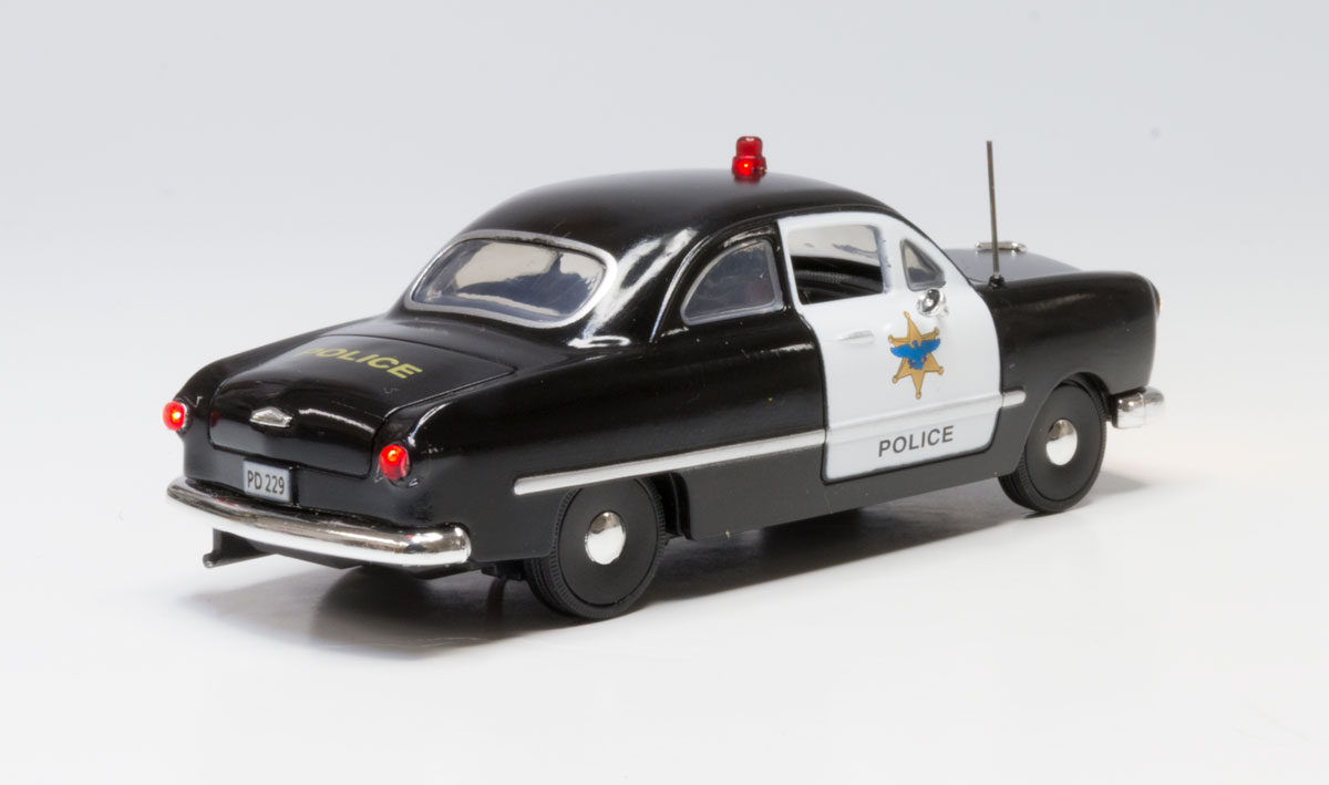 Police Car - O Scale - Protecting the town and looking for hooligans, this Police Car isn't afraid to flag down those rambunctious law breakers