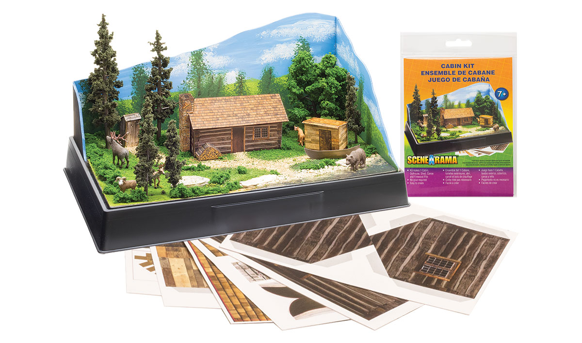 Cabin Kit - Pre-cut graphics and materials to make a cabin with a stack of firewood outside, an outhouse, a detached shed and a boat