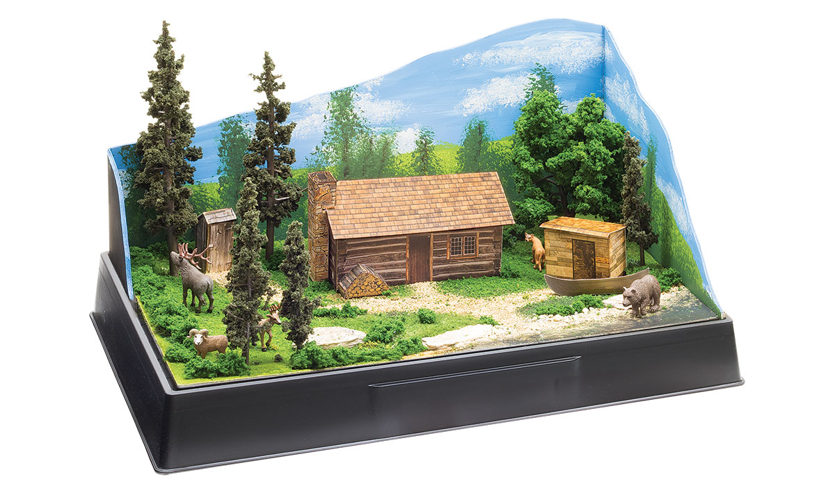 Cabin Kit - Pre-cut graphics and materials to make a cabin with a stack of firewood outside, an outhouse, a detached shed and a boat